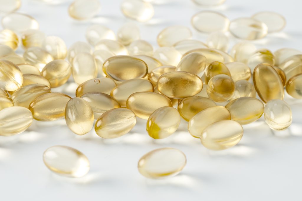 Dietary Supplement Q&A. Dietary supplements with clear gold colored liquid inside gel caps.