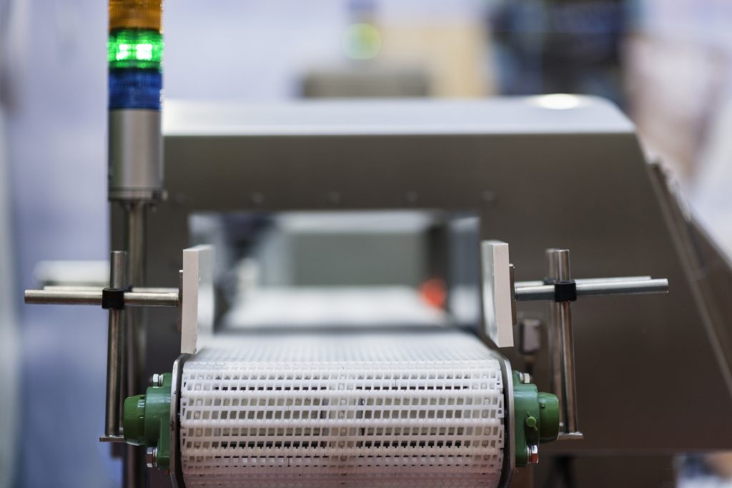 Close up of a metal detector conveyor to illustrate validating foreign material control equipment.